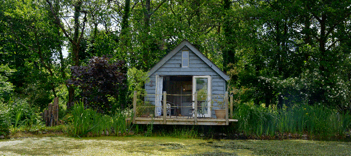 Big Man Tiny Homes – wooden cabin exterior by lake