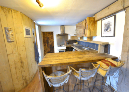 Big Man Tiny Homes – interior rustic wooden cabin kitchen