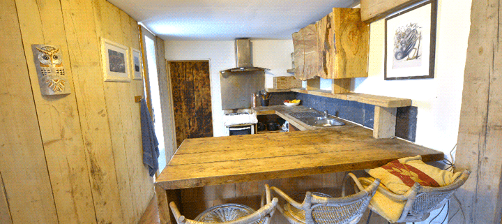 Big Man Tiny Homes – interior rustic wooden cabin kitchen